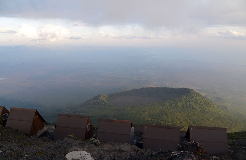 Some of the 12 guest cabins atop Nyiragongo