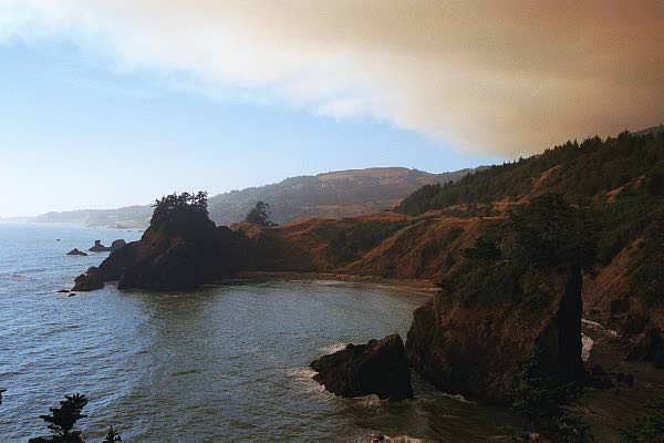 Clouds of forest fire smoke with blue sky to the north from Windy Point