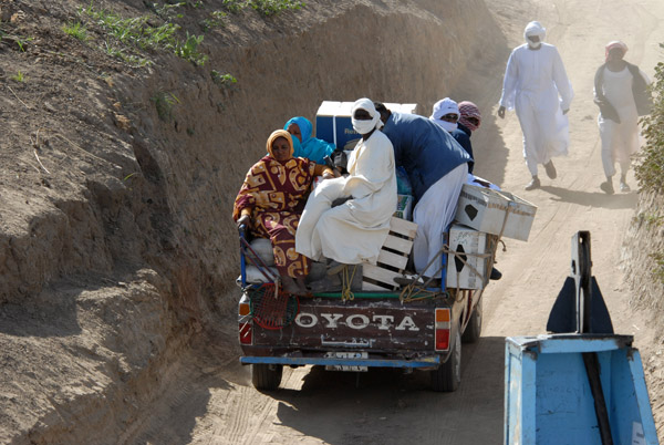 Another overloaded pickup boarding the Old Dongola Ferry