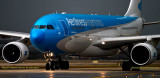 Aerolineas Argentinas Airbus A330-223 LV-FNJ taxiing in after landing on runway 27 before a storm aviation airline stock photo