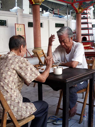A game of Chess at a Chinese Temple, near the Shangri-La