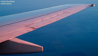 2002 - wing of Continental Airlines B737-824 at sunrise over South Florida aviation stock photo